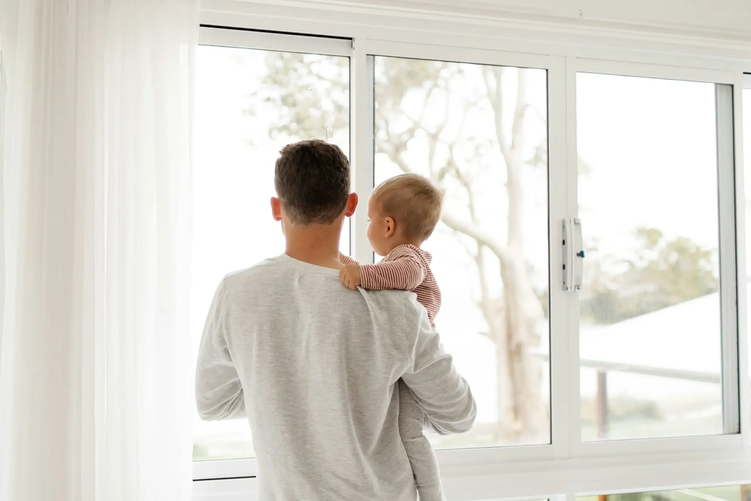 Man carrying his child scaled