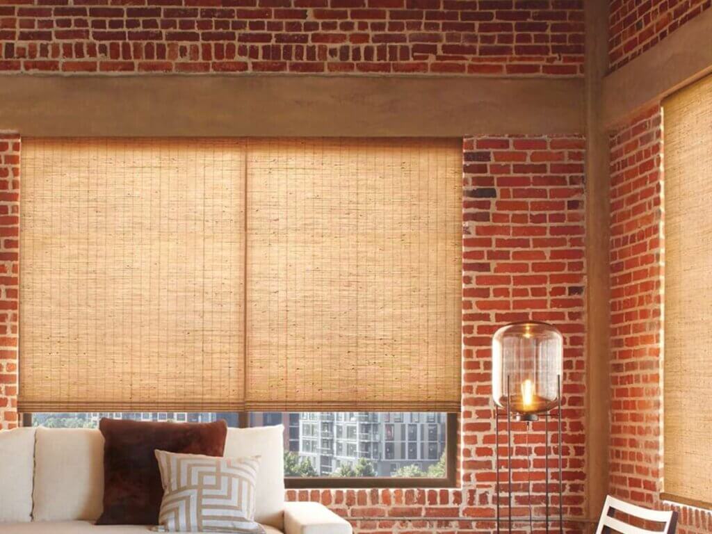 This is a photo of woven wood shades in a living room