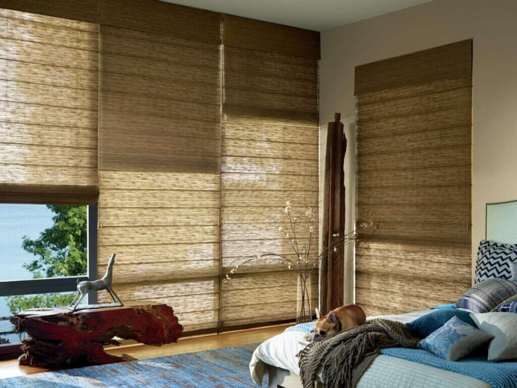 This is a photo of a woven wood shades in a bedroom